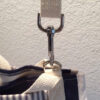 crossbody strap clipped to anchors close up